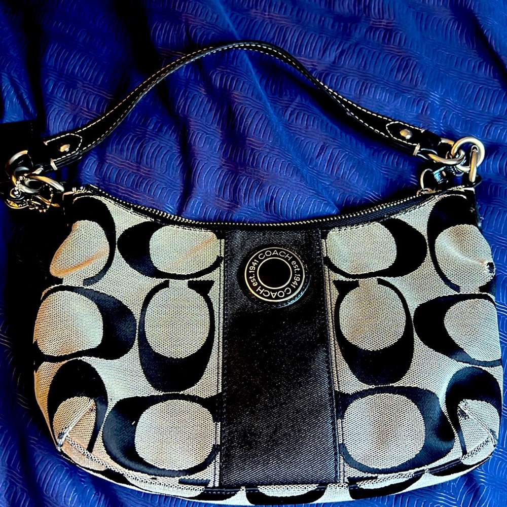 Black and gray Coach purse medium sized